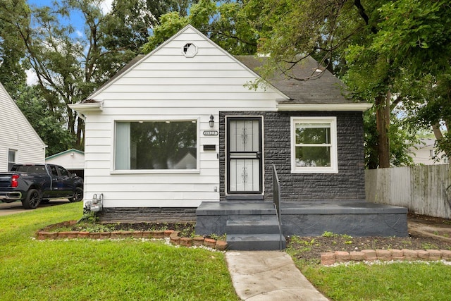 bungalow with a front yard