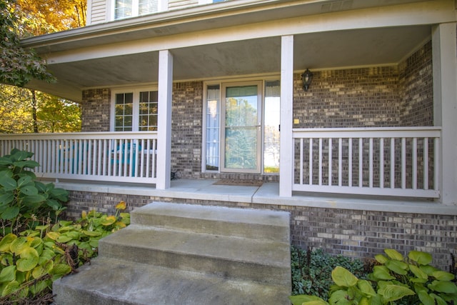 property entrance featuring covered porch