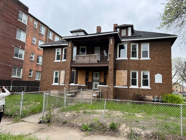 view of front of home with a balcony