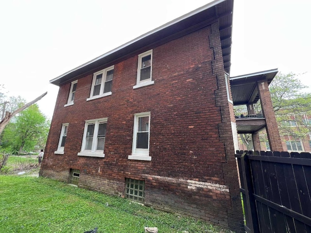 view of home's exterior featuring a yard