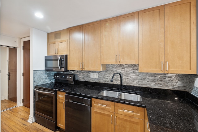 1001 W Jefferson Ave Unit 2E, Detroit, MI 48226 - kitchen with electric stove, a sink, black dishwasher, stainless steel microwave, and decorative backsplash