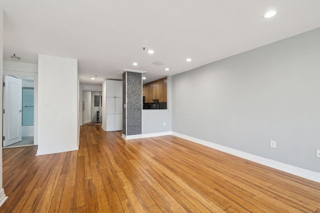 unfurnished living room with light hardwood / wood-style flooring