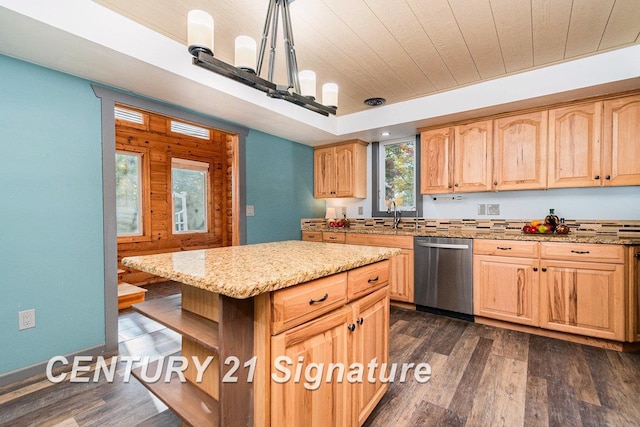 kitchen featuring dishwasher, light brown cabinetry, decorative light fixtures, a kitchen island, and dark hardwood / wood-style flooring