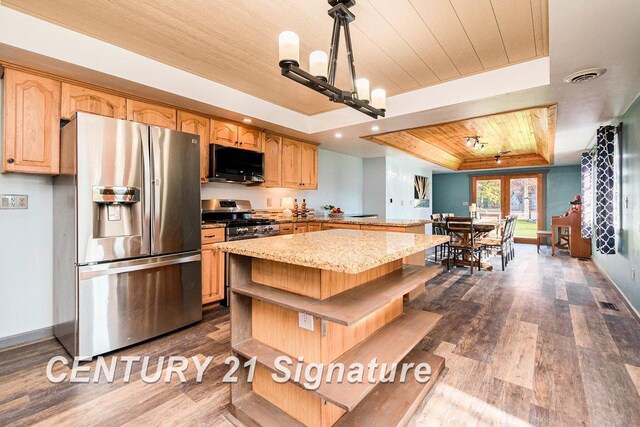 kitchen featuring a tray ceiling, wooden ceiling, dark hardwood / wood-style flooring, and stainless steel appliances