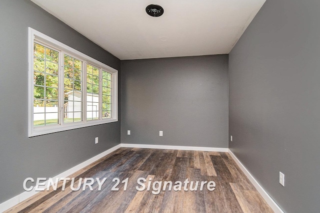 unfurnished room featuring dark hardwood / wood-style floors