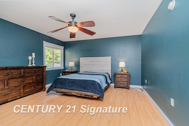 bedroom featuring ceiling fan and light hardwood / wood-style floors