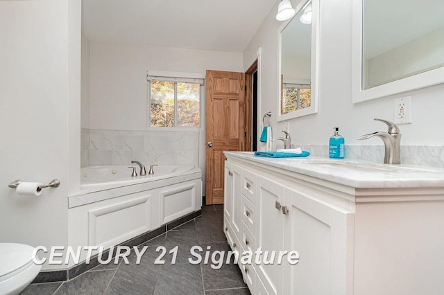 bathroom with a tub to relax in, tile patterned flooring, vanity, and toilet