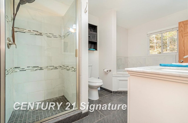 bathroom featuring tile patterned flooring, vanity, toilet, and a shower with door