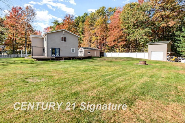 view of yard with an outbuilding and a deck