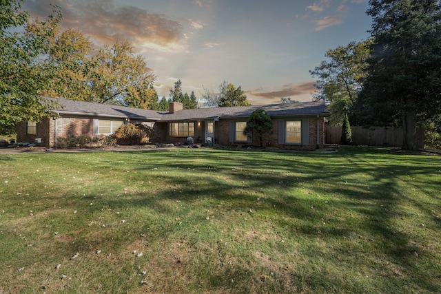 view of front of property with a yard