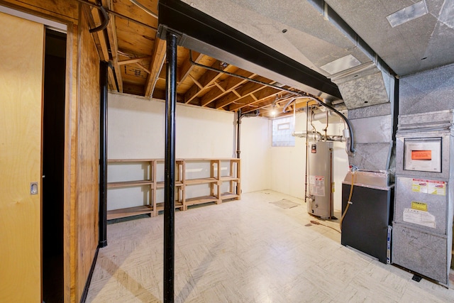 basement featuring heating unit and water heater