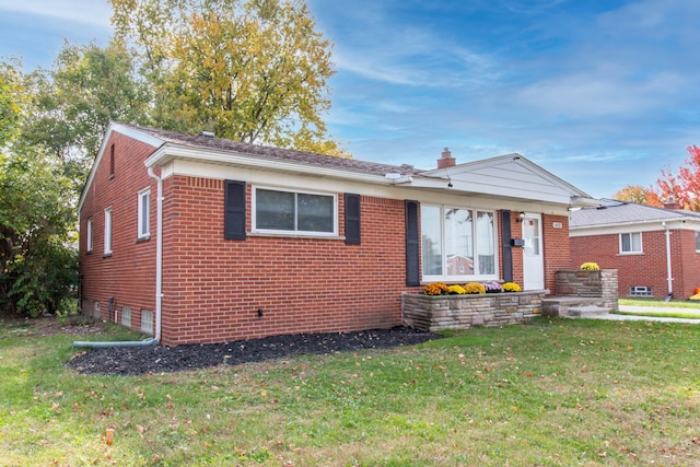 bungalow with a front yard