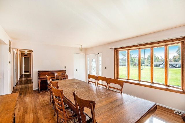 dining area featuring dark hardwood / wood-style floors