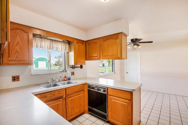 kitchen featuring kitchen peninsula, sink, plenty of natural light, and black dishwasher