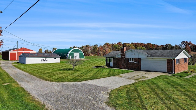 view of home's exterior with an outbuilding and a yard