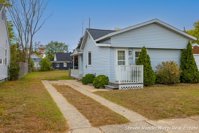 view of property exterior with a lawn