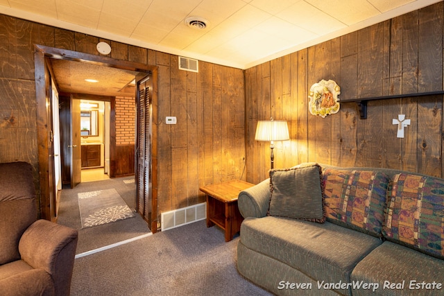 living room with wooden walls and carpet