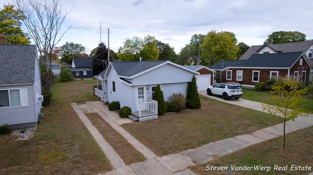 bungalow-style house with a front lawn