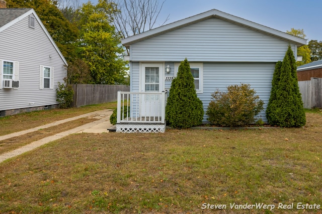 exterior space with a lawn and cooling unit