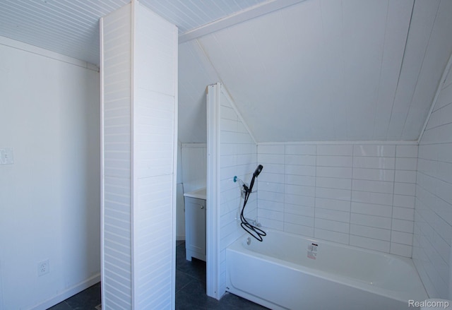 23930 Elmira St, Saint Clair Shores, MI 48082 - bathroom featuring lofted ceiling, a bathtub, and tile patterned flooring