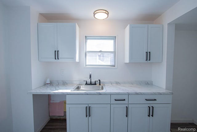 23930 Elmira St, Saint Clair Shores, MI 48082 - kitchen with light countertops, dark wood-type flooring, and white cabinetry