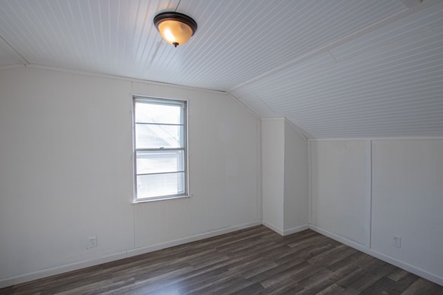 additional living space with dark hardwood / wood-style flooring and lofted ceiling