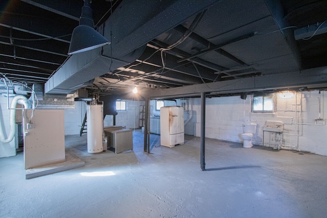 basement featuring washer / clothes dryer and gas water heater