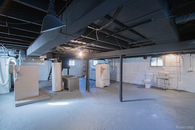 23930 Elmira St, Saint Clair Shores, MI 48082 - below grade area featuring water heater, washer / clothes dryer, and healthy amount of natural light
