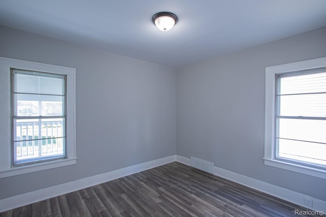 23930 Elmira St, Saint Clair Shores, MI 48082 - unfurnished room with healthy amount of natural light and dark wood-type flooring