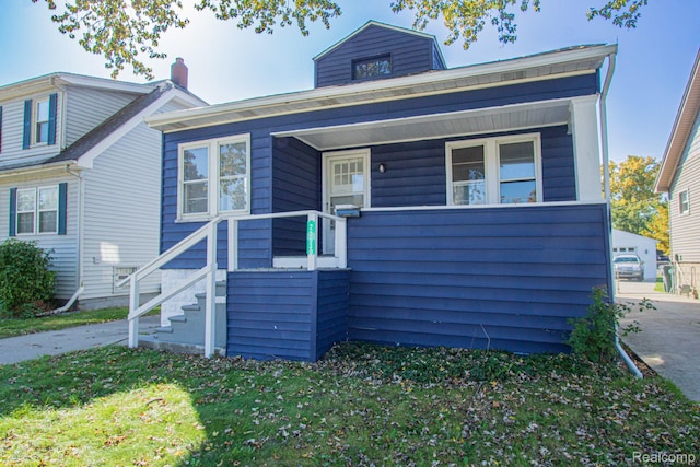 23930 Elmira St, Saint Clair Shores, MI 48082 - view of front facade featuring a front lawn