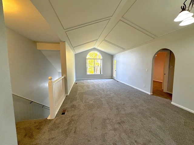 additional living space with carpet and vaulted ceiling