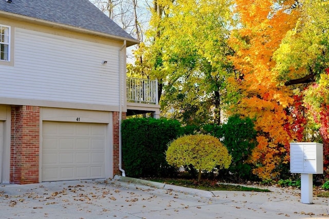 view of side of property with a garage