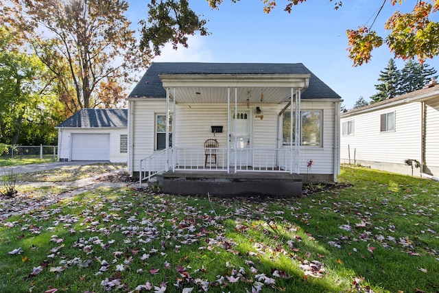 view of front facade with a porch, a garage, and a front yard