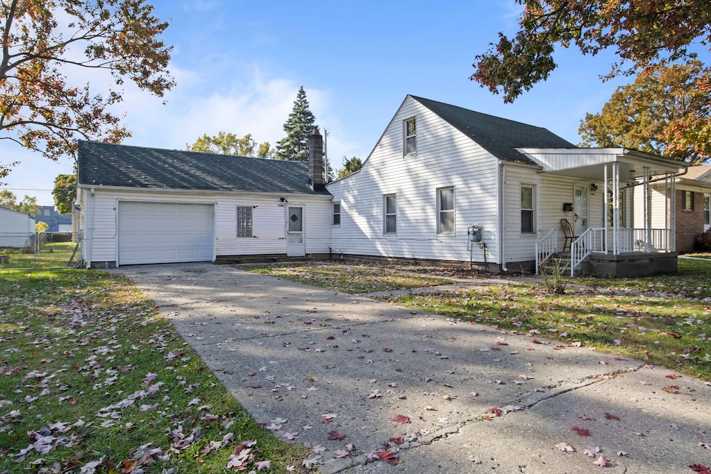 view of front facade with a porch and a garage