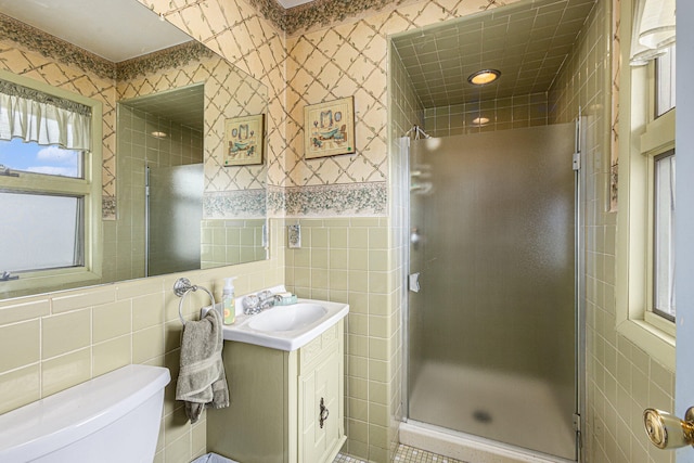 bathroom featuring walk in shower and tile walls