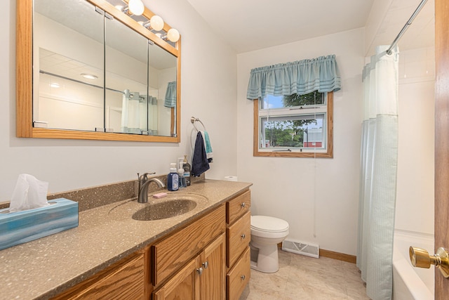 full bathroom with vanity, shower / bath combination with curtain, and toilet