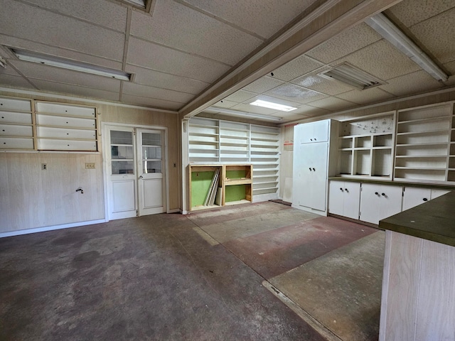 garage featuring wooden walls