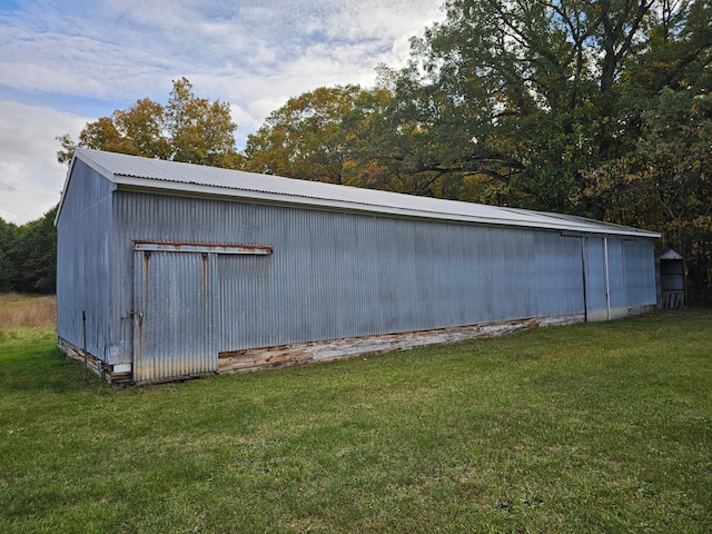 view of outbuilding with a lawn