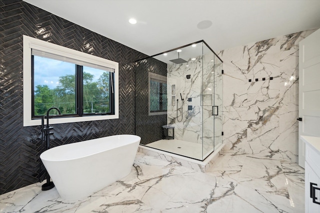 bathroom with independent shower and bath and tile walls