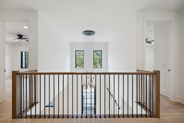 corridor with light hardwood / wood-style flooring