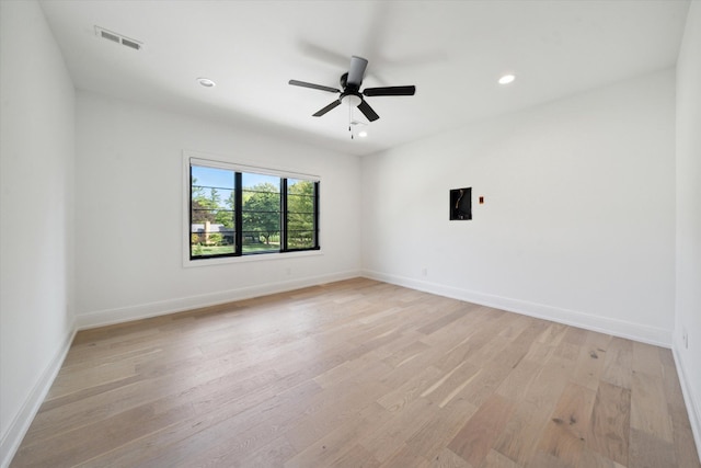 unfurnished room featuring ceiling fan and light hardwood / wood-style flooring