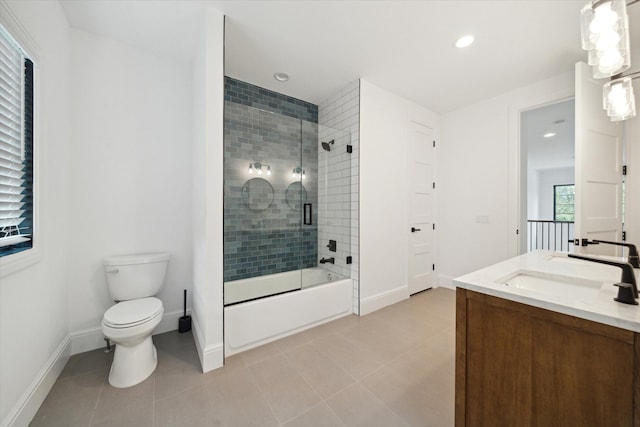 full bathroom featuring tile patterned flooring, vanity, combined bath / shower with glass door, and toilet