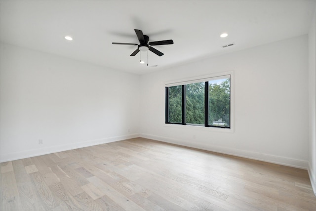 unfurnished room with ceiling fan and light hardwood / wood-style flooring