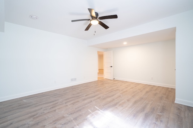 spare room featuring ceiling fan and light hardwood / wood-style flooring