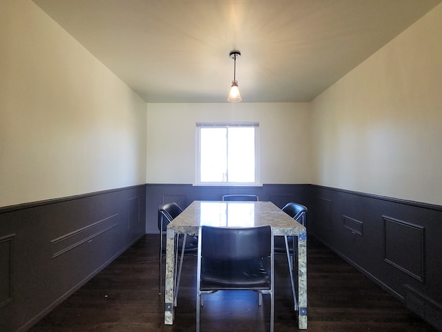 dining space with dark wood-type flooring