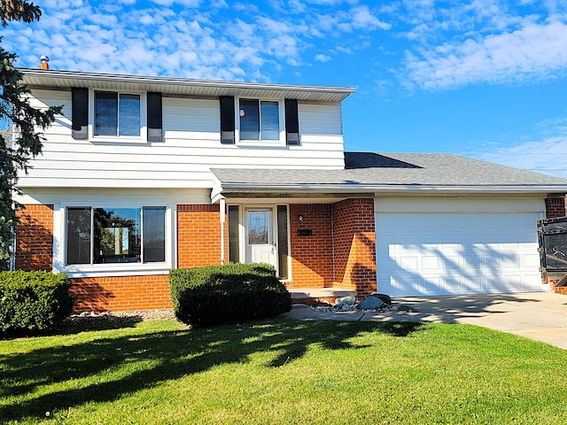 front facade featuring a garage and a front lawn