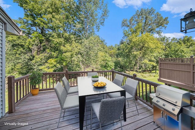 wooden deck with area for grilling