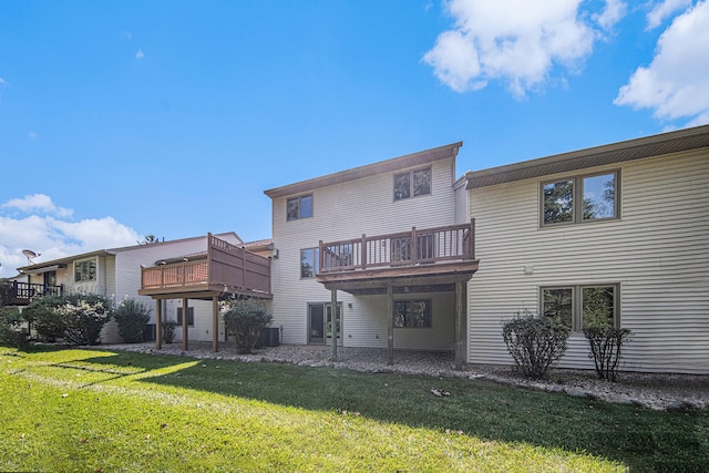 back of house featuring a yard, a deck, and cooling unit