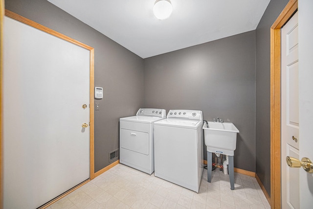 laundry area featuring independent washer and dryer