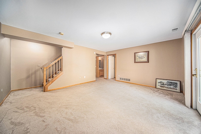 unfurnished living room featuring carpet